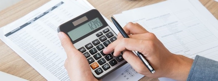 Man using calculator to count income and outcome